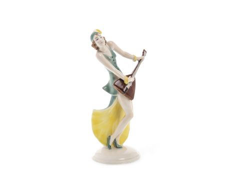 ART DECO GOEBEL FIGURE OF A LADY, modelled playing a balalaika, 26cm high