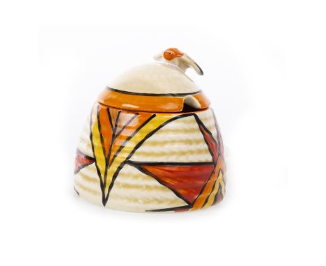 CLARICE CLIFF FOR WILKINSON BIZARRE 'SUN BURST' PATTERN HONEY POT AND COVER, in the form of a beehive with applied bee handle