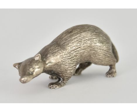 Three Elizabeth II Cast Silver Models of Animals, comprising - badger by Sarah Jones, London 1986, chased with natural fur-ef