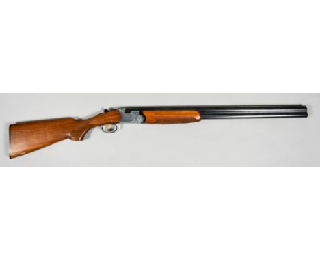 A 12 Bore Over and Under Shotgun by Beretta, serial no. E57374B, 28ins blued steel barrel with elevated top rib, bright steel