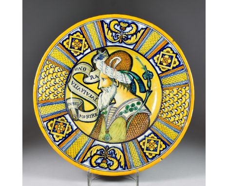 An Italian Maiolica Dish in the Deruta Style, Late 19th Century, the centre painted with the head of a Turk and a verse from 