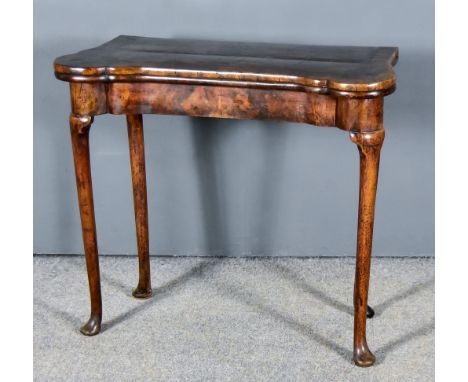 An 18th Century Walnut Tea Table,&nbsp;with shaped top inlaid with feather banding and cross bandings, with plain apron, on t