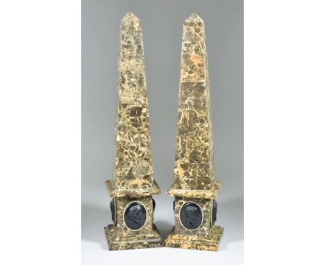 A Pair of Variegated Marble Obelisks, the square bases each inset with four glass classical intaglios, on square stepped base