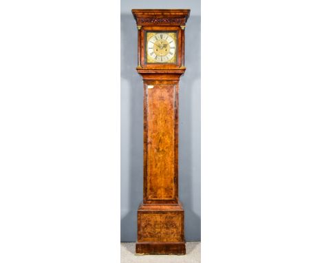 An 18th Century Walnut Longcase Clock, by Edward Adams, London, the 11ins square brass dial with wide silvered chapter ring, 