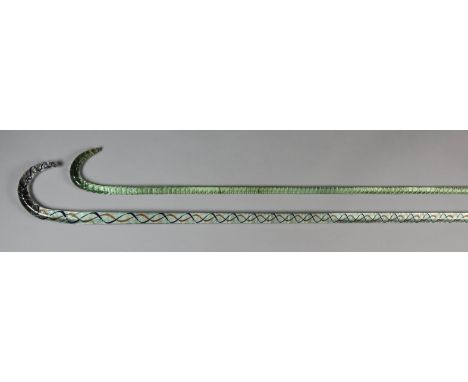A Nailsea Glass Walking Stick, Mid 19th Century, with blue, red and white coloured twist, 39.25ins, and a plain example with 