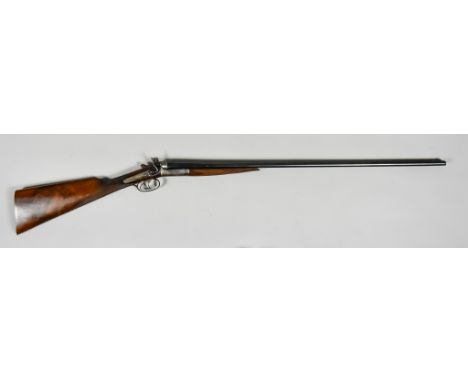 A .410 Side by Side Shotgun, serial no. 2512, (Belgian), 28ins blued steel barrel, bright steel side lock action with blued h