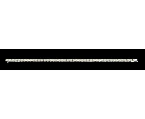 An 18ct White Gold Diamond Tennis Bracelet, set with approximately 10ct of brilliant cut white diamonds, 210mm overall, total