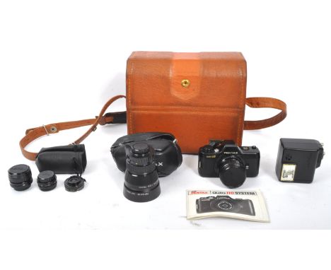 An vintage 20th century Asahi Pentax Auto 110 SLR System. The set including a Pentax Auto 110 SLR camera, Pentax-110 24mm, 50