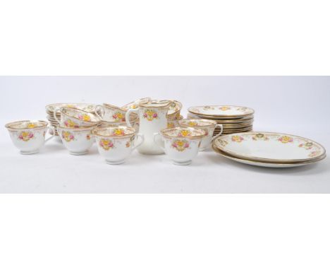 A Victorian 19th century Royal Albert crown china part tea service. The lot to include twelve cups &amp; saucers, twelve dess