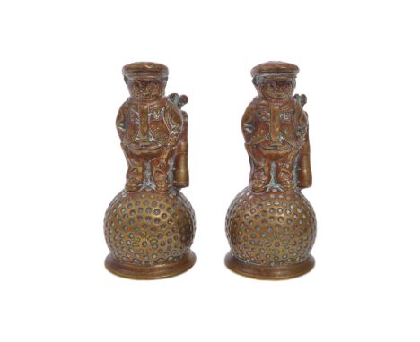 A pair of early 20th century circa 1920s brass&nbsp;Dunlop 31 golfer on golf ball promotional mascots. Each measuring approx.