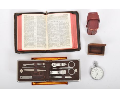 An assortment of vintage gents travel curios to include a military issue Nero Lemania chrome stopwatch with British governmen