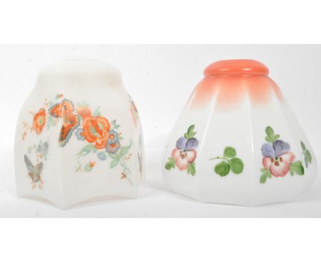 Two early 20th century thin white porcelain ceiling light lamp shades, delicately hand painted in a colourful floral design.&