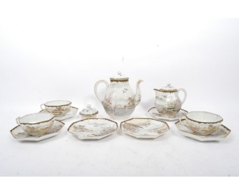 A vintage 1940s Japanese tea service of hand painted design. The service depicts a scene of a small village by the water surr