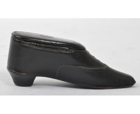 A George III ebonised snuff box in the form of a shoe. Inlaid wirework design with hinged opening lid to reveal the snuff com