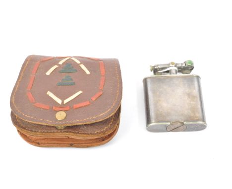 An early 20th Century circa 1930s silver plated Dunhill unique lighter. Patent number: 143752. With a leather holder case.