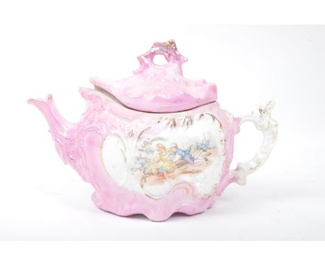 A vintage 19th Century German Sitzendorf style teapot. With hand painted Genre scene in a pink colour way with gilt detailing