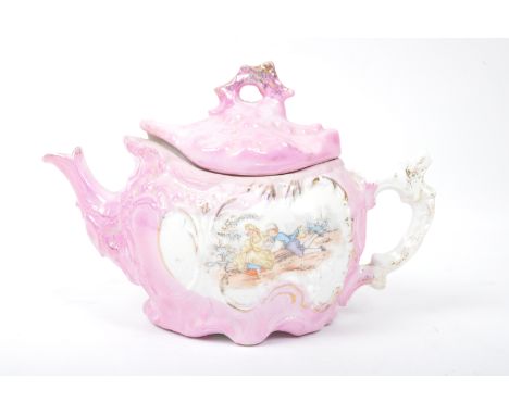 A vintage 19th Century German Sitzendorf style teapot. With hand painted Genre scene in a pink colour way with gilt detailing