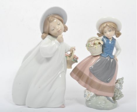A collection of two ceramic Lladro figurines - Hand made in Spain. Daisa. Comprising of two girls, both young child girls wit