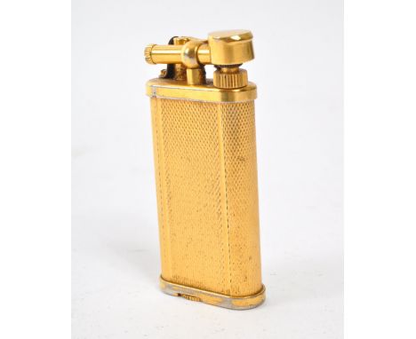 A retro vintage 20th century circa 1970s Dunhill gilt brass lighter having reeded decoration to the tank. Makers stamp to the