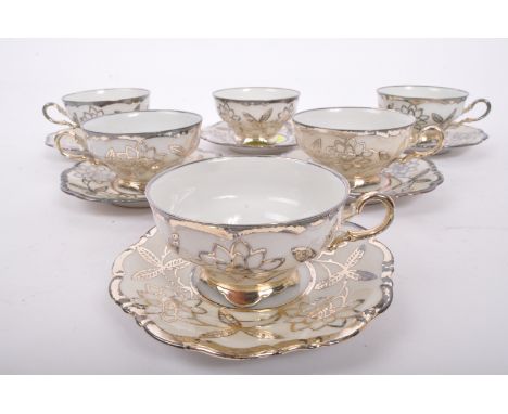 A vintage mid 20th century circa 1940s German Hutschenreuther Hohenberg lustre silver overlay coffee service. The set compris