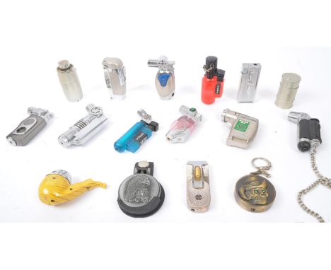 An assortment vintage 20th century Novelty cigarette pocket lighters to include torch gun shaped lighters, skull themed light