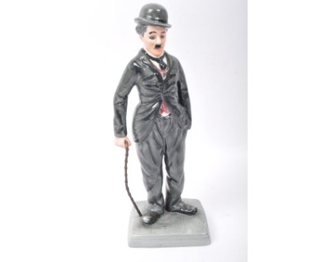 Royal Doulton - A limited edition Royal Doulton hand painted bone china Charlie Chaplin figurine. Modelled by William K. Harp