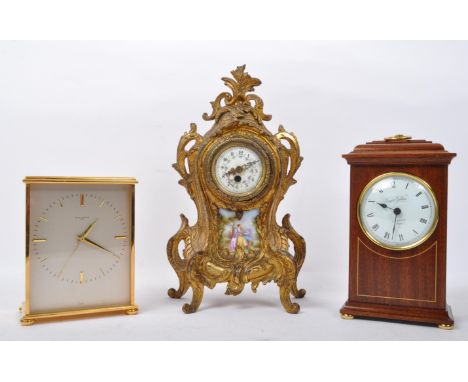 An assortment of three vintage 20th century mantel carriage clocks. The lot to include a Regency style mantel clock with gilt