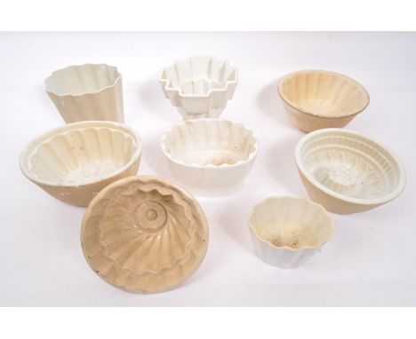 A collection of 19th century Victorian and later ceramic jelly moulds to include a Copeland example alongside a number of jel