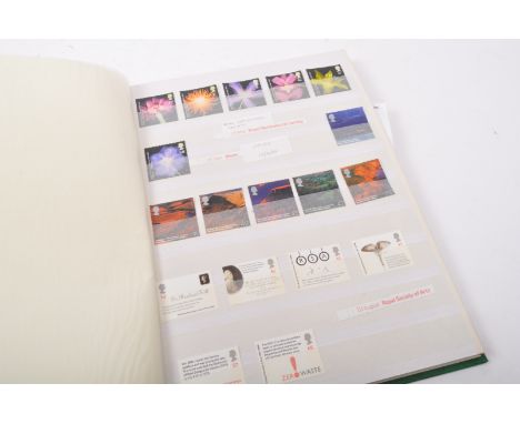 A collection of 20th century unfranked post decimal British postage stamps held within a single brown leather presentation fo
