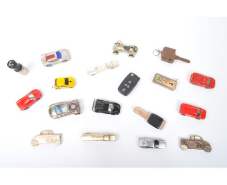 An assortment of vintage 20th century Novelty car themed cigarette pocket lighters. The lot to include various cars sizes &am