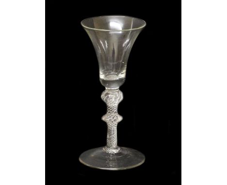 A Large Wine Glass, circa 1745, the bell-shaped bowl on an air twist stem with shoulder ball knop and mid-blade knop18.5cm hi