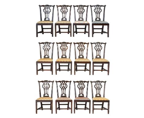 A Set of Twelve Chippendale Design Carved Mahogany Dining Chairs, late 19th century, with later recovered drop-in seats, the 