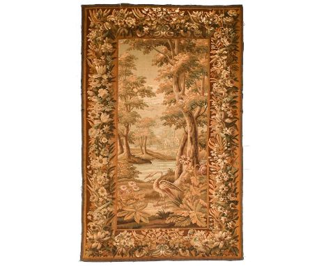 Aubusson Verdure TapestryCentral France, 18th/19th century Depicting an exotic bird beneath a wooded landscape and water with