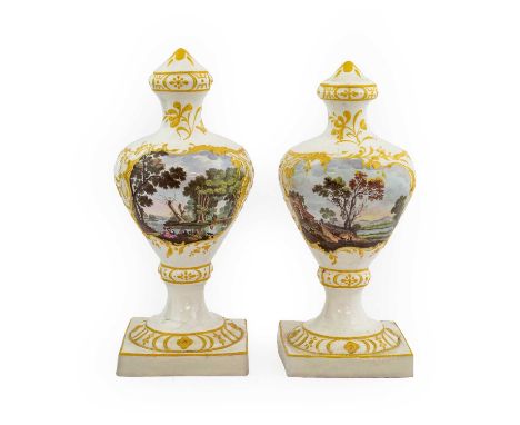 A Near Pair of South Staffordshire Enamel Vases, circa 1770, of urn shape, painted with figures in landscapes within moulded 