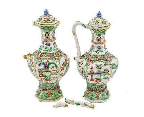 A Pair of Chinese Porcelain Puzzle Jugs and Covers, Kangxi, of hexagonal baluster form, painted in famille verte enamels with