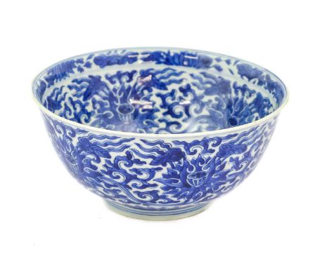 A Chinese Porcelain Bowl, Kangxi reign mark and of the period, of circular form with everted rim, painted in underglaze blue 