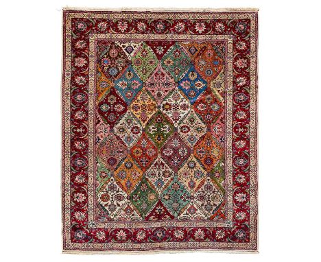 Benlian Tabriz CarpetNorth-West Iran, circa 1930The polychrome diamond lattice of vines and palmettes enclosed by raspberry m