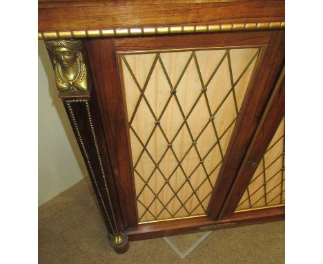 A Regency Rosewood and Gilt-Metal Mounted Chiffonier, early 19th century, the upper section with pierced brass gallery and tu