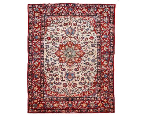 Isfahan Carpet Central Iran, circa 1960 The ivory field of vines around a medallion framed by spandrels and crimson borders o