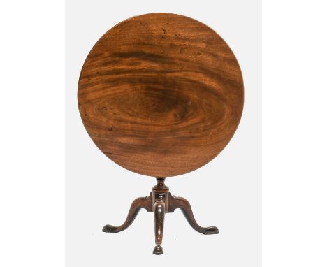 A George III Mahogany Tripod Table, the circular one-piece flip-top above a block support with journeyman stamp LP, on a vasi