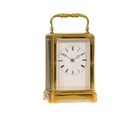 A Brass Engraved Striking Carriage Clock, circa 1890, case with scroll and floral engraving, carrying handle, enamel dial wit