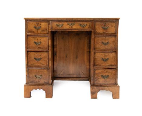 A George II Walnut, Feather-Banded and Cross-Banded Kneehole Dressing Table, 2nd quarter 18th century, the quarter-veneered m