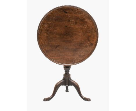 A George III Mahogany Dish-Top Tripod Table, circa 1780, the moulded one-piece top on a baluster turned support with three ca