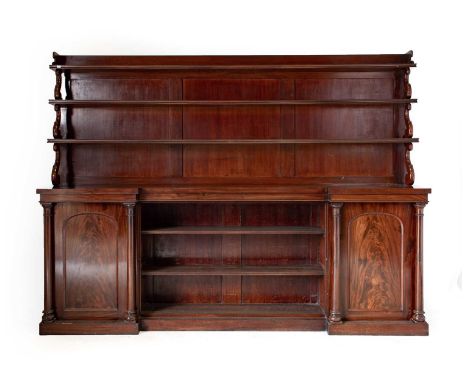 A Victorian Mahogany Library Bookcase, 3rd quarter 19th century, the upper section as a three-tier waterfall bookcase with th