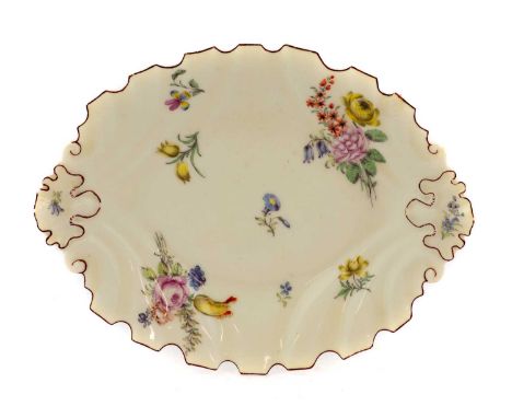 A Chelsea Porcelain Silver Shape Dish, circa 1755, painted with scattered flower sprays and sprigs within a brown line border