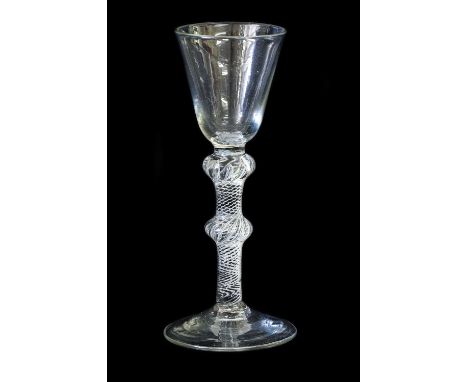  A Wine Glass, circa 1755, the rounded funnel bowl on a double-knopped air twist stem and circular foot15.5cm highSome light 