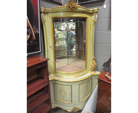 A modern green painted and glazed corner cabinet, 202 x 115cm together with a pair of console tables, 101cm wide en suite (3)