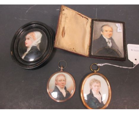 Three 19th century and later portrait miniatures on ivory and a small kpm type porcelain miniature  