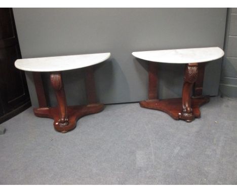A pair of Victorian walnut and marble demi-lune console tables, 59cm x 90cm each  