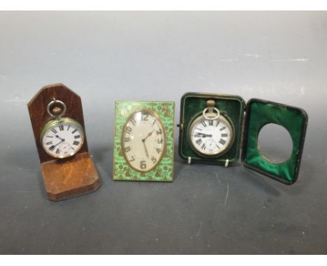 A Goliath pocket watch in a leather travelling case, another on an oak stand and an Art Deco bedside clock and another by Asp